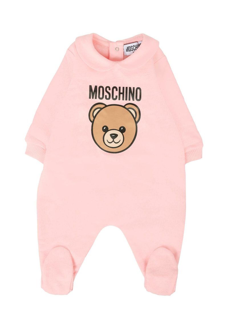 Pink baby onesie made of soft fabric, featuring a rounded collar, a bear graphic, and the text "MOSCHINO" above it. Footed design with cuffs.