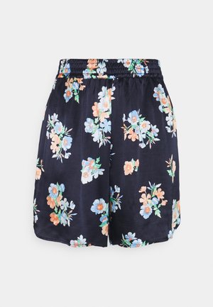 Shorts floraux navy avec un pantalon élastique, présentant un mélange de fleurs bleues, pêches et vertes sur un tissu lisse et léger.
