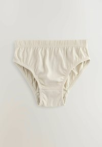 Beige Baumwollslip mit elastischem Bund, weicher Textur und gerafften Seiten. Einfaches Design ohne Muster oder Akzente.