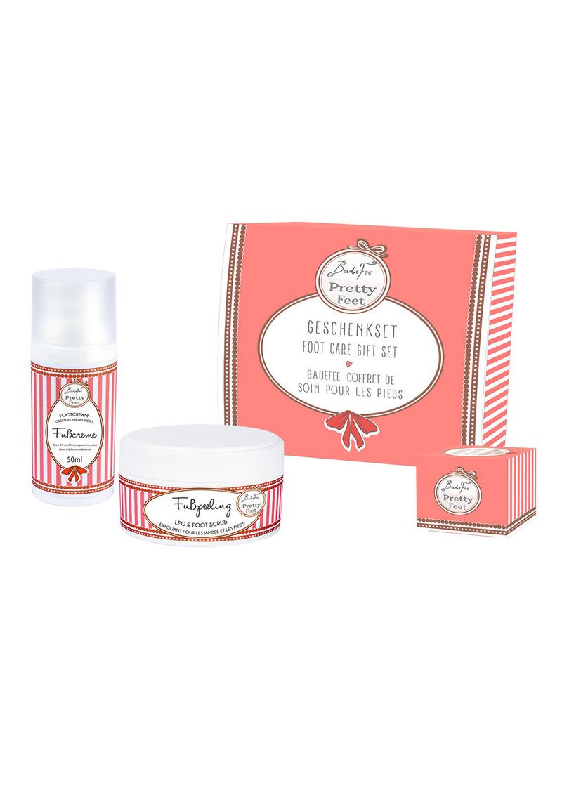 Foot care gift set with a pink box, featuring a foot cream, foot scrub, and a small container. All items have decorative labels with alternating stripes.