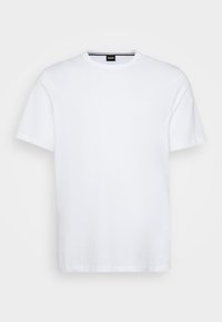 Bílý krátký rukáv tričko vyrobené z bavlny. Má kulatý výstřih, klasický střih a diskrétní značkovou etiketu na vnitřním límci.