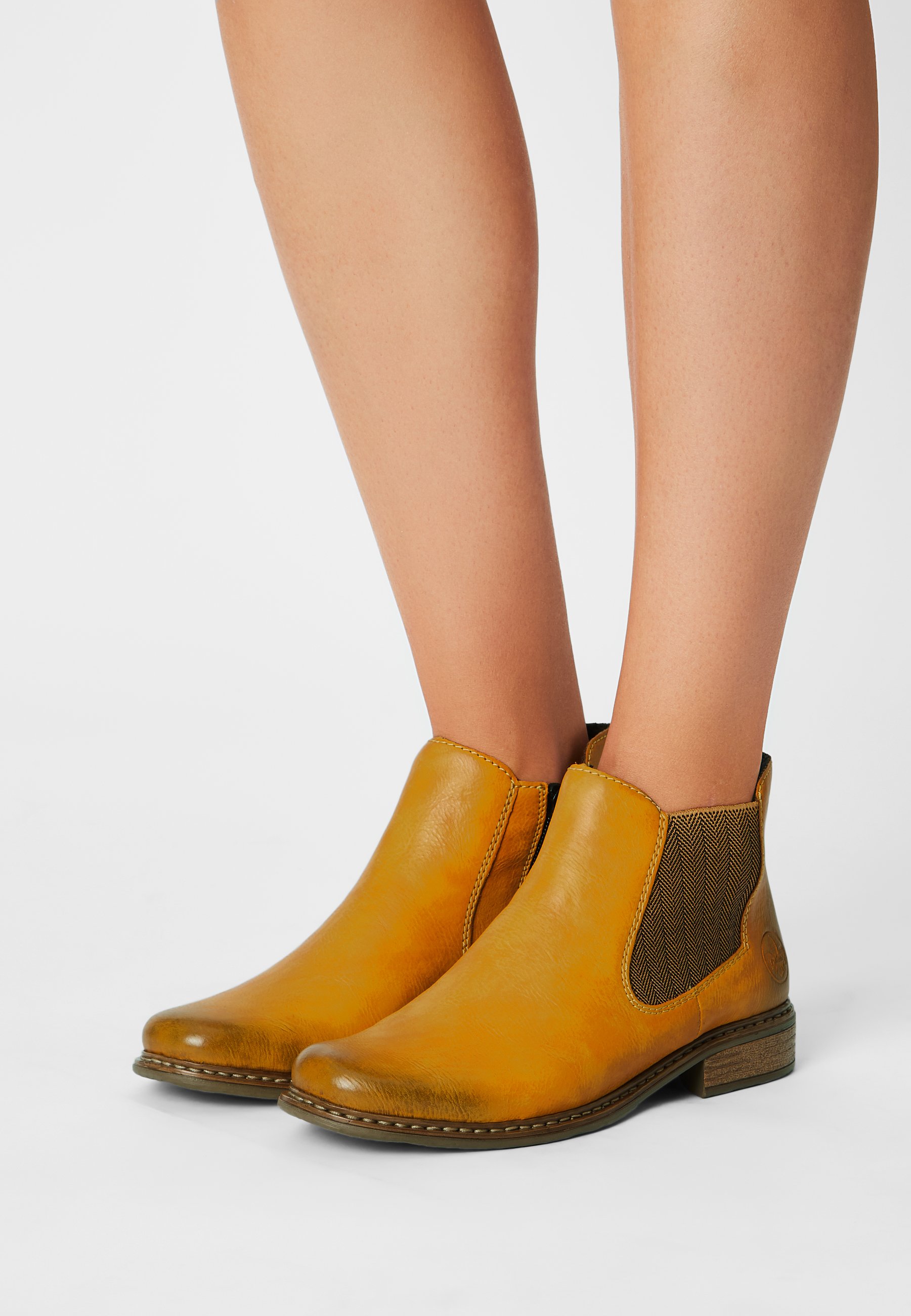 yellow rieker boots