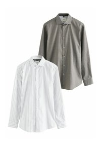 Two dress shirts: one white with vertical stripes, the other dark gray with small white polka dots. Both have button closures and collars.