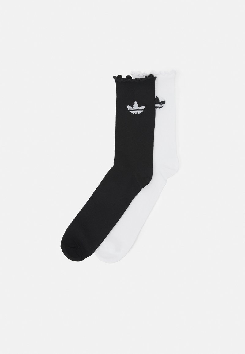 Two pairs of cotton crew socks, one black and one white, each featuring a ribbed cuff and the Adidas logo in black embroidery.