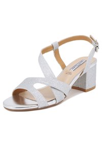 Sandal con tacco a blocco in glitter argento, con cinturini incrociati, punta aperta e soletta ammortizzata. Cinturino alla caviglia regolabile con fibbia metallica.
