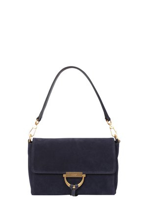 Black suede handbag with a gold clasp and a single black shoulder strap attached by gold hardware.