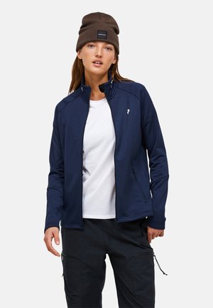 Marineblaues Zip-Jackett aus glattem Stoff mit hohen Kragen, das ein weißes Logo auf der Brust und zwei seitliche Reißverschlusstaschen aufweist.