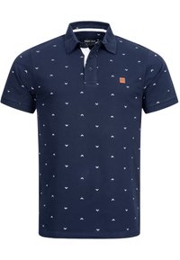 Polo bleu marine à manches courtes avec petits motifs flèches blancs et patte de boutonnage à deux boutons.