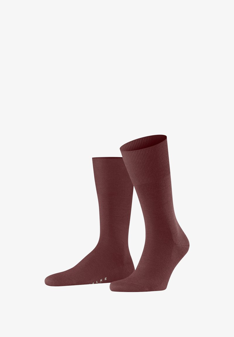 Burgunderfarbene Baumwollsocken mit geripptem Bund und glatter Oberfläche, ausgestattet mit einer nahtlosen Zehenpartie und Branding an der Sohle.