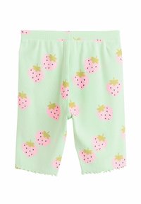Gröna ribbade shorts med ett jordgubbsmönster i rosa och gult med svarta frön, designade med en scallopkant.