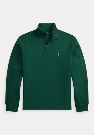 Pull vert à manches longues avec col à fermeture éclair sur un quart et petit logo brodé sur la poitrine gauche.