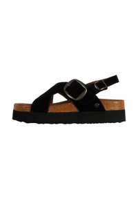 Sandalia de ante negro con una plantilla de corcho, hebillas ajustables, una suela gruesa negra y un diseño de tiras en cruz.