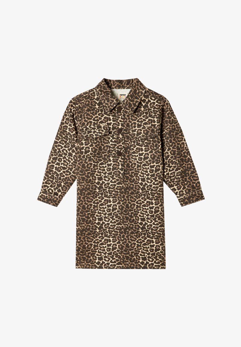 Mekko, jossa on leopardikuvio, pitkät hihat, painonappisuljenta ja kaksi rintataskua. Ruskeat ja beigen sävyt luovat voimakkaan, tekstuurisen kuvion.