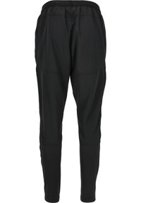 Schwarze Sporthose mit elastischem Bund, tapered Beinen und strukturierten Einsätzen an den Seiten. Weicher, leichter Stoff, der sich für Sportbekleidung eignet.