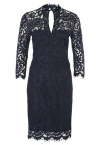 Robe en dentelle bleu marine à mi-longueur avec des manches trois-quarts, motif floral, décolleté en trou de serrure et ourlet et poignets festonnés.