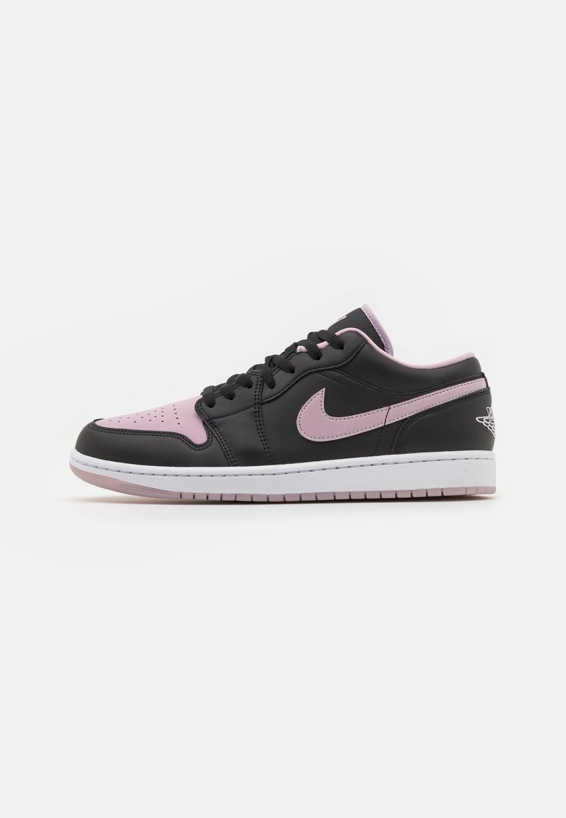 Low-top sneaker with a black leather upper, pink accents, perforated toe box, lacing system, and a white midsole with a pink outsole.