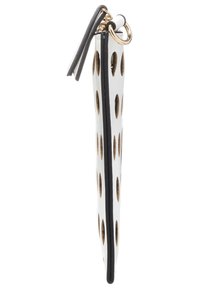 Valkoisilla pilkkuilla varustettu pussi, jossa on kultaisia yksityiskohtia, musta reuna ja sivuzipperi. Ominaista on teksturoitu muotoilu, jossa on ovaaleja aukkoja kauttaaltaan.