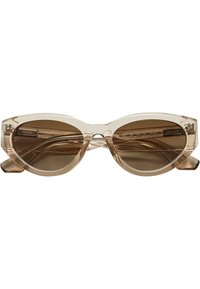 Kattögon-solglasögon med en transparent beige ram och brun tonade linser. Har tunna skalmar med ingraverade detaljer på insidan.