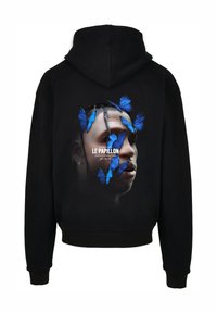 Sweat à capuche noir avec un grand graphique d'un visage entouré de motifs de papillons bleus. Le texte indique "LE PAPILLON" en blanc. Matière douce.