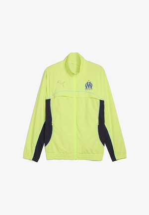 Neon-gelbe Sportjacke mit Reißverschluss und schwarzen Seitenpaneelen, Puma-Logo auf der rechten Brust und Emblem des Olympique de Marseille auf der linken Brust.
