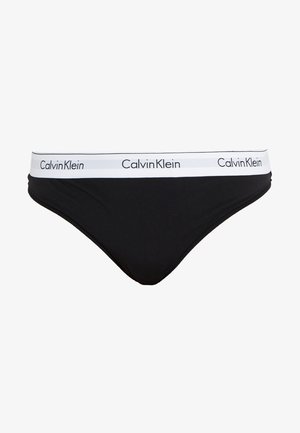 Black briefs made from soft fabric with a white elastic waistband featuring "Calvin Klein" branding. Classic cut with a smooth texture.