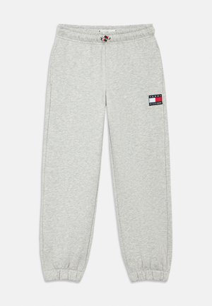 Lichtgrijze joggingbroek met elastische boorden, trekkoord in de taille en een Tommy Hilfiger-logo op de rechterdij.