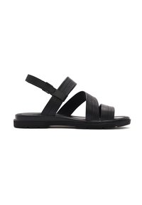 Black leather sandals with three broad straps, adjustable ankle strap, and textured sole for grip. Flat design for comfort.