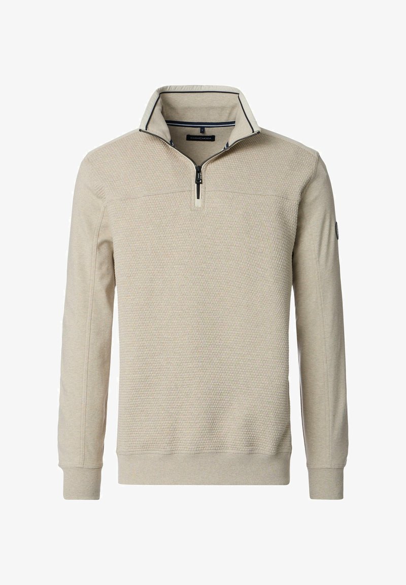 Beige quarter-zip pullover made from textured fabric, featuring a contrasting navy trim on the collar, and ribbed cuffs and hem.