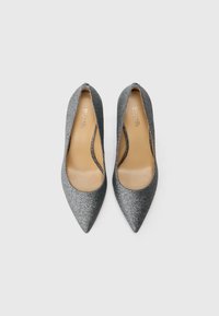 Gray glitter high-heeled pumps with a pointed toe, sleek design, and a beige inner lining. No visible hardware or patterns.