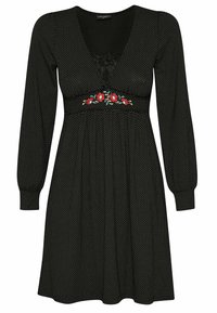 Robe noire à pois blancs, à manches longues, décolleté en V et broderie florale à la taille. Tissu doux avec un design fluide.