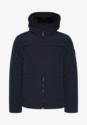 Chaqueta acolchada azul marino con cierre de cremallera en la parte delantera, capucha ajustable, dos bolsillos en el pecho y puños elásticos. Textura suave y diseño minimalista.