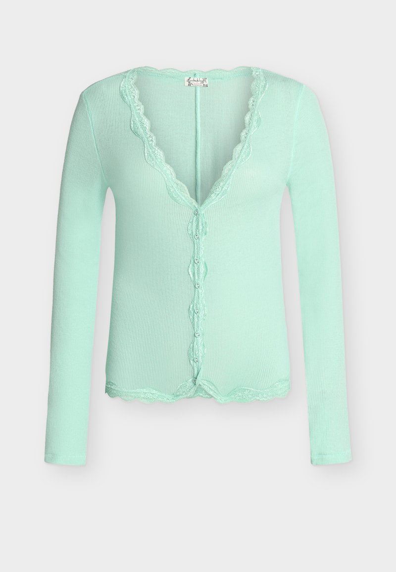 Πανωφόρι με μακριά μανίκια σε ανοιχτό πράσινο, ριπ υφή, με λεπτομέρειες δαντέλας με κυματιστό σχέδιο κατά μήκος του ντεκολτέ, κλείσιμο με κουμπιά και τελείωμα.