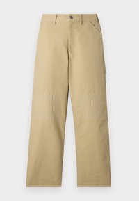 Khaki bomullsbyxor med rak passform, featuring vita korsstygn på knälagningar och en framknappstängning.