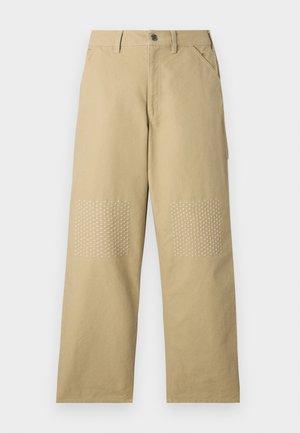 Khaki cotton pants with a straight-leg design, featuring white cross-pattern stitching on knee patches and a front button closure.