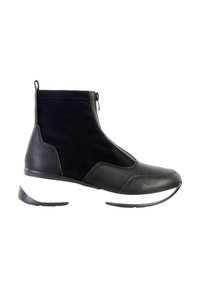 Bottine noire à fermeture éclair, mélange de matériaux en cuir et textile, bout arrondi et semelle contrastante noire et blanche.