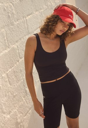 Self. Leggingsit - black