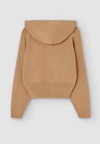 Krótkia bluza z kapturem w jednolitym beżowym kolorze, z regulowanym kapturem, długimi rękawami oraz ściągaczami przy hemie i mankietach. Wykonana z miękkiego materiału dzianinowego.