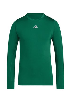 Ciemnozielona, sportowa koszulka z długim rękawem, z małym białym logo Adidas umieszczonym centralnie poniżej kołnierzyka.