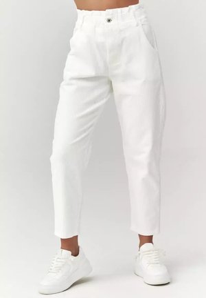 - Spodnie materiałowe