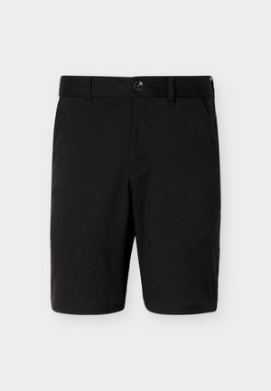 Pantalones cortos negros hasta la rodilla con cierre frontal de botón y cremallera, trabillas para cinturón y bolsillos laterales sobre un fondo claro y liso.