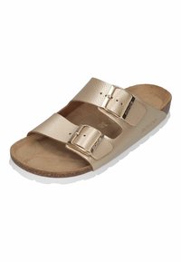 Gold, leather two-strap sandal with adjustable metal buckles, textured upper, cushioned footbed, and white rubber sole.
