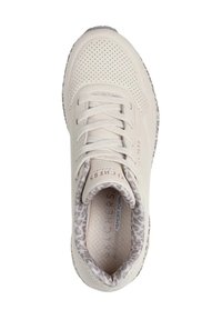 Light beige sneaker with perforated upper, lace closure, and animal print lining. Features cushioned memory foam insole, rubber outsole.
