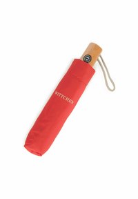 Red compact umbrella with a wooden handle, featuring a textured grip and a wrist strap. Branding visible on the cover.