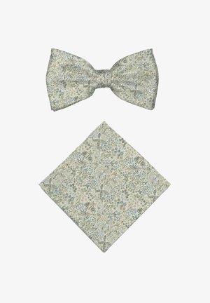 Light beige floral patterned bow tie and matching pocket square laid flat on white background.
