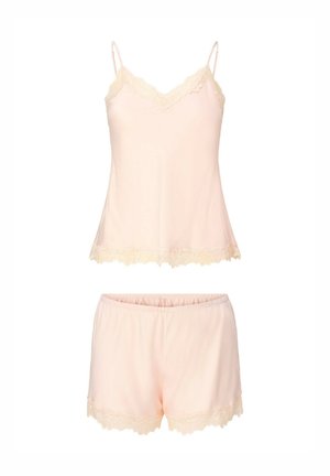 Light pink satin camisole and shorts pajama set with lace trim on neckline, hem, and shorts edges.
