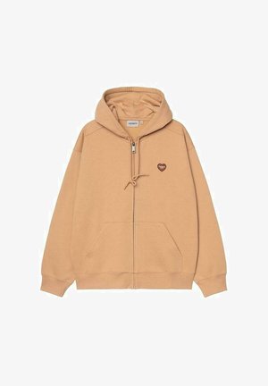 Sweat à capuche beige zippé avec poche kangourou, capuche à cordon ajustable et petit patch logo en forme de cœur sur la poitrine.