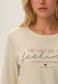 Henderson FREJA mleczny