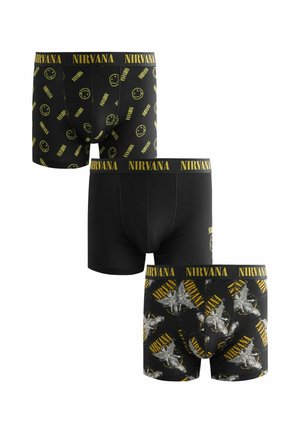 Boxers noirs avec le logo et les motifs jaunes de Nirvana : l'un avec un visage souriant, l'autre avec un motif d'étoiles, taille élastique avec marquage.