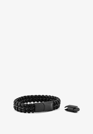 Black braided bracelet made of durable material with a flat clasp. Features a smooth texture and a detachable hardware piece.