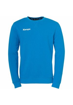 Blue sweatshirt made of cotton blend, featuring long sleeves, crew neck, and a white "Kempa" logo on the left chest. Smooth texture.